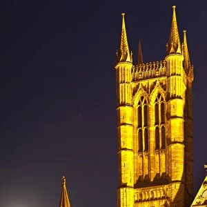 England, Lincolnshire, Lincoln. Full moon behind Lincoln Cathedral in the historic UK city of Lincoln