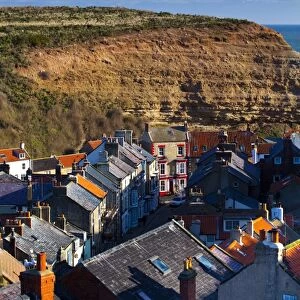 England, North Yorkshire, Staithes. View looking down on the roofs and chimney pots of the old town of Staithes, located within the North York Moors