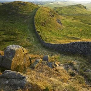ENGLAND Northumberland Hadrians Wall Sunset behind the world heritage site of Hadrians Wall near the town of