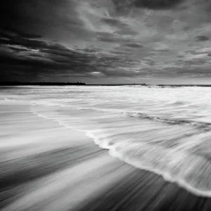 England, Tyne and Wear, South Shields. The North Sea crashes onto the sandy beach at South Shields