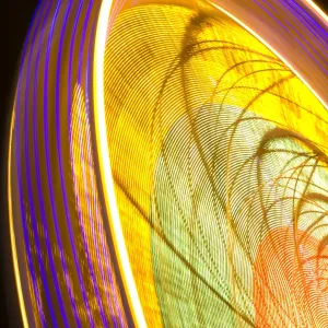 Scotland, Edinburgh, Christmas Fair. A Ferris wheel forming part of the city Christmas fair held near the Scott Monument in East Princes