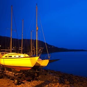 Scotland, Scottish Highlands, Ullapool. Sailing boats moored near the busy port at Ullapool on the shores of