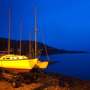 Scotland, Scottish Highlands, Ullapool. Sailing boats moored near the busy port at Ullapool on the shores of