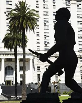 Argentina Gallery: Argentina, Buenos Aires Province, Buenos Aires. Silhouted statue of a soldier outside a military