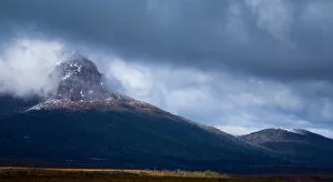 Australia, Tasmania, Cradle Mt - Lake St Clair National Park. Dramatic storm clouds clear revealing Mount Pelion West