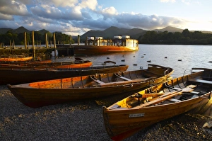 England, Cumbria, Lake District National Park. Wooden rowing boats and Derwent Water