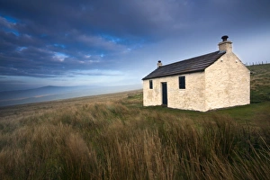 North Pennines Collection: England, Cumbria, North Pennines. A small cottage located within the barren landscape of Hartside
