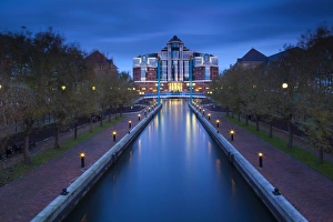 England, Greater Manchester, Salford Quays. Victoria Harbour building beyond Mariners Canal footbridge on the Manchester Ship Canal located