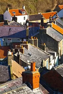 England, North Yorkshire, Staithes. View looking down on the roofs and chimney pots of the old town of Staithes