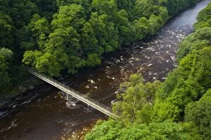 North Pennines Collection: England, Northumberland, Lambley Viaduct. Lambley footbridge crossing the River South Tyne as it