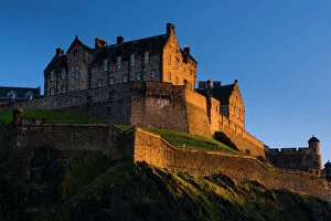 Tourist Attraction Gallery: Scotland, Edinburgh, Edinburgh Castle. The last light of the setting sun illuminates Edinburgh