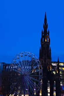 Images Dated 23rd November 2009: Scotland, Edinburgh, Princes Street. Ferris Wheel alongside the Monument to Sir Walter Scott