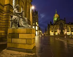 Images Dated 9th January 2009: Scotland, Edinburgh, The Royal Mile. Hume statue with the St Giles Cathedral