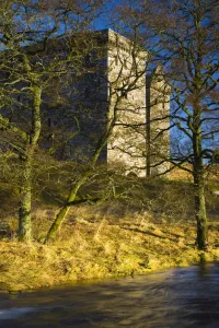 Scotland, Scottish Borders, Hermitage Castle. Hermitage water running in front of the Hermitage Castle Scotland, Scottish Borders, Hermitage Castle. Hermitage water running in front of the Hermitage Castle