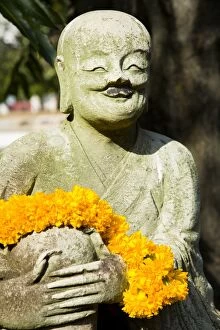 Religion Gallery: Thailand, Bangkok, Wat Benchamabophit. Statue in the grounds of the Wat Benchamabophit also known as
