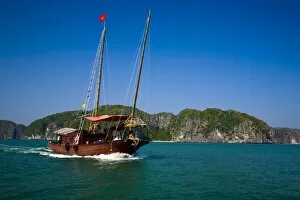 Vietnam Gallery: Vietnam, Northern Vietnam, Halong Bay. Tourist boat amid the islands of Halong Bay near Cat Ba Island