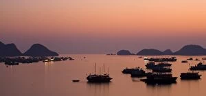 Pink Gallery: Vietnam, Northern Vietnam, Halong Bay. The pink sunset afterglow at dusk over Cat Ba harbour